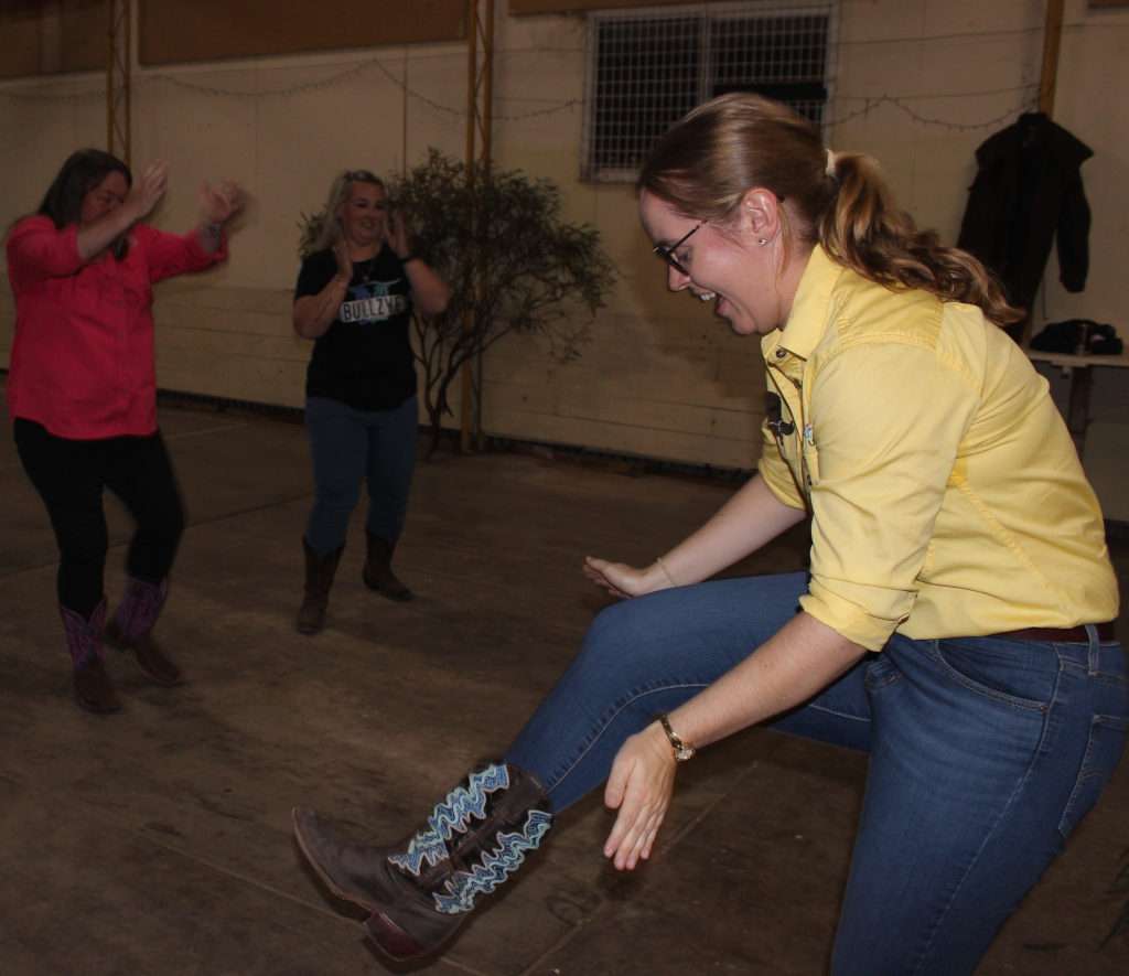 Claire leg clap with Carmen Jonas & Leyanne Jolly behind