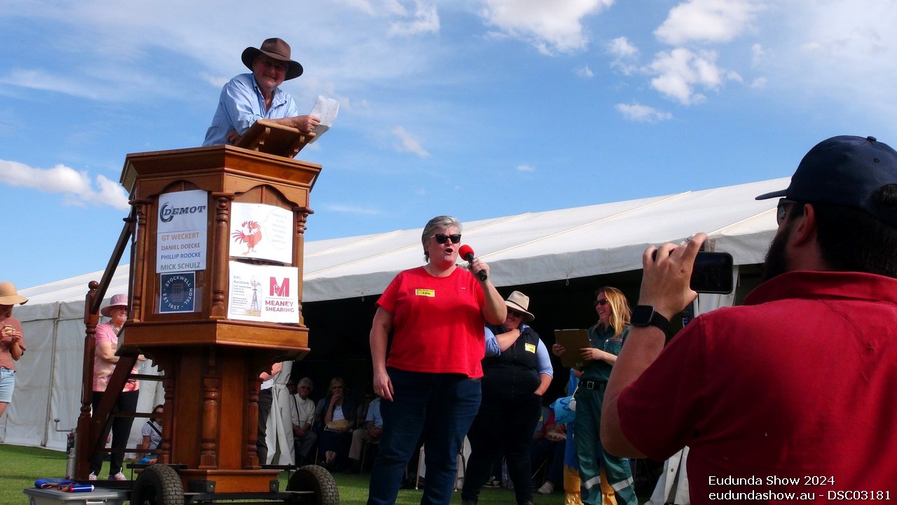 Alison Schiller the ultimate winner of the Eudunda Show Rooster Crowing Competition with father Budgie Schiller looking on